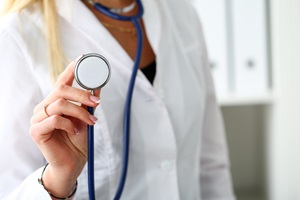 doctor holding stethoscope 